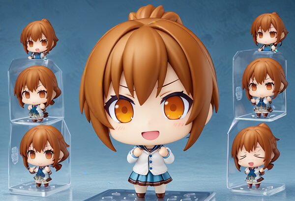 She is a cute anime girl with expressive big brown eyes and brown hair tied into a ponytail. Nendoroid. Chibi figure, bright colors, cute expression